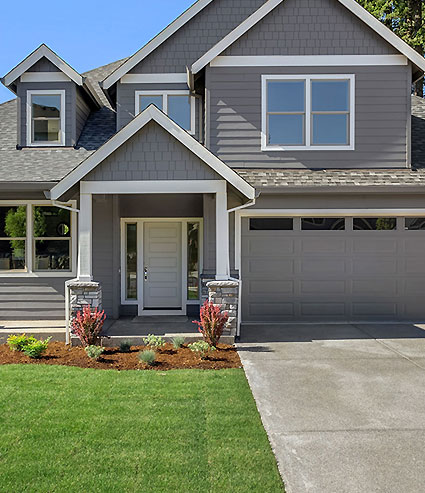 beautiful home with a new garage door