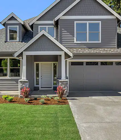 beautiful home with a new garage door